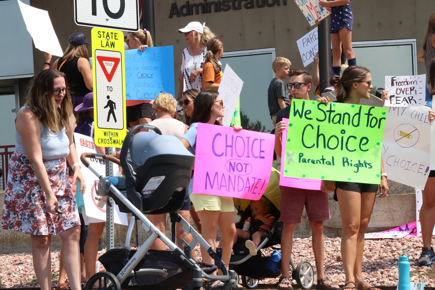 Signs read, "Choice not mandate!" and "We stand for choice, parental rights" at a protest against school mask requirements on Aug. 30 in Arapahoe County.
Similar protests by students and parents were seen across the metro area. Associated questions about how schools should approach COVID-19 issues were centerpieces of every school board election forum this year.